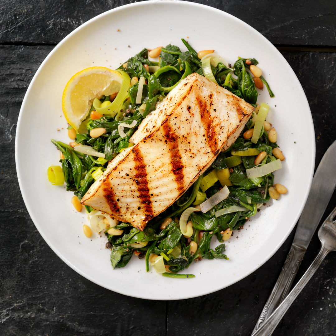 Grilled Alaskan Halibut over Garlicky Greens